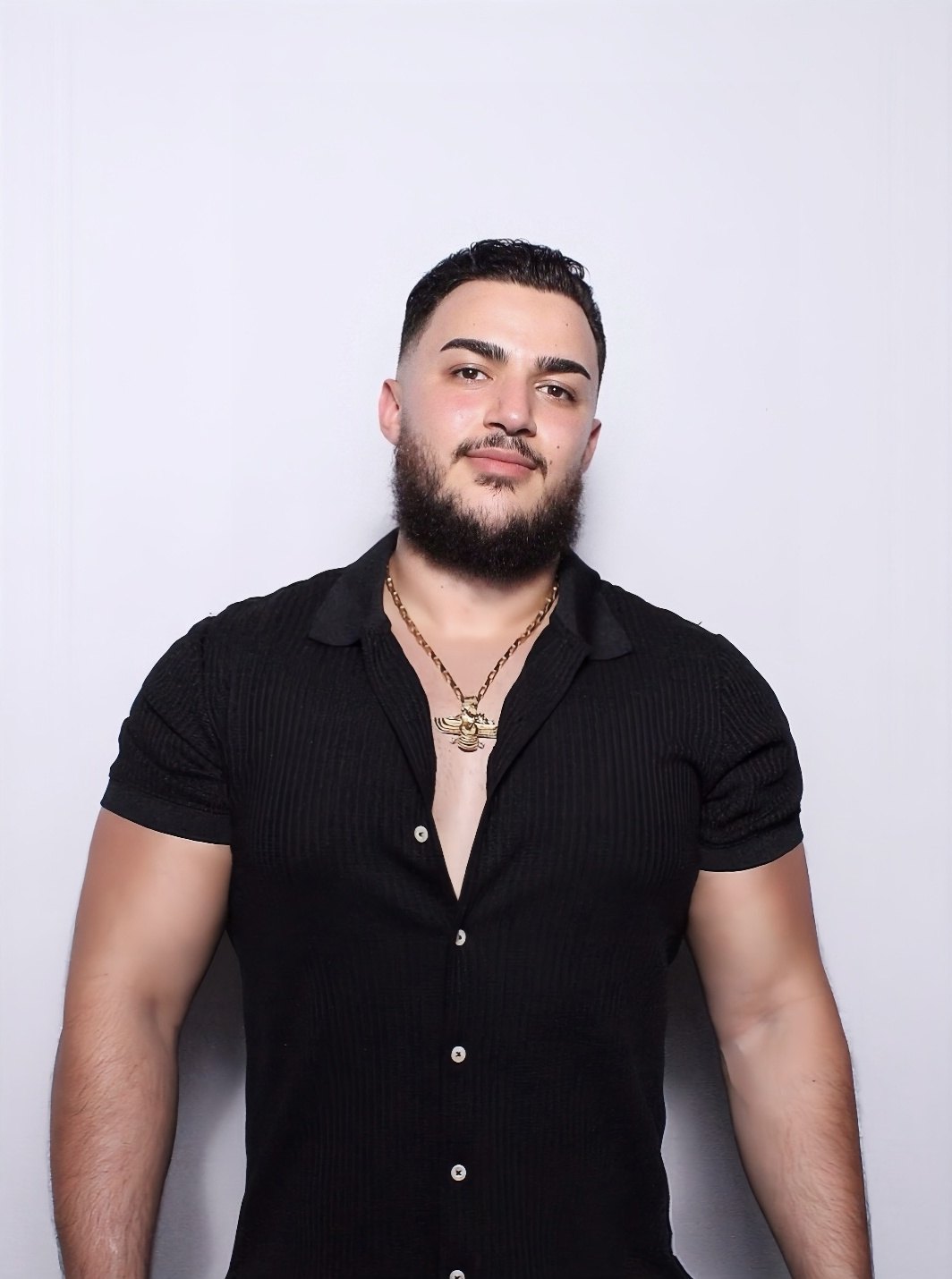 Sepehr, personal trainer and competitive bodybuilder, in a black shirt